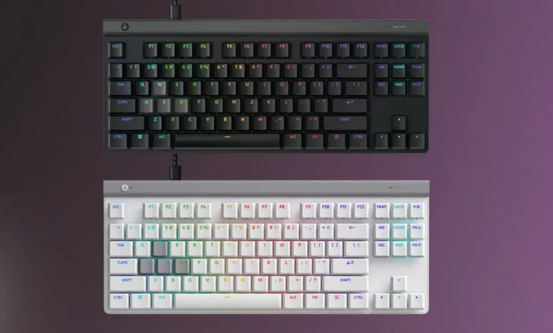 Black and white keyboards with rainbow backlighting shown from above.