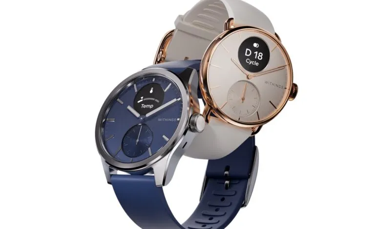 Two Withings ScanWatch smartwatches, one with a blue face and navy band, the other with a cream face and white band.