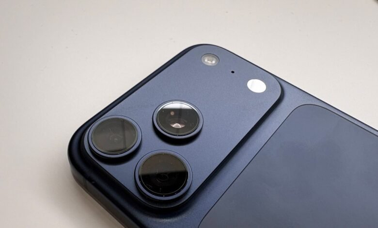 Close-up of iPhone camera lenses and flash. Three lenses are visible, along with a flash and a microphone.