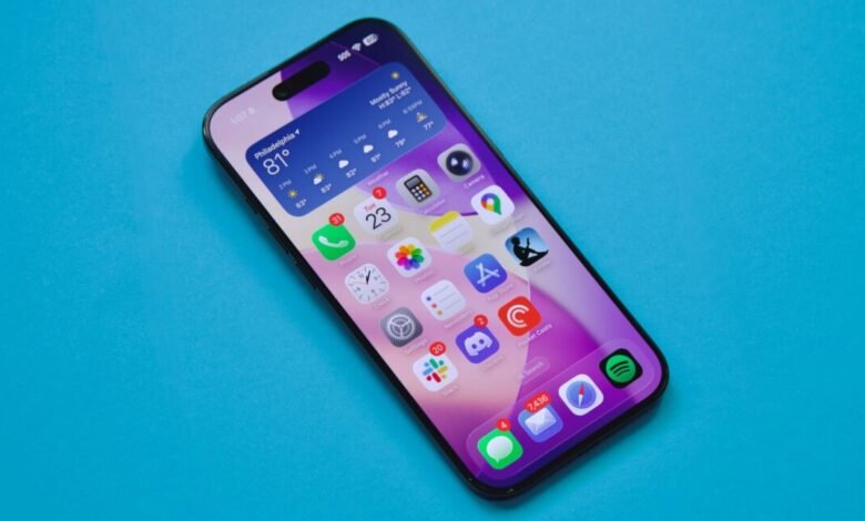 iPhone displaying weather, apps, and time on a vibrant blue background.