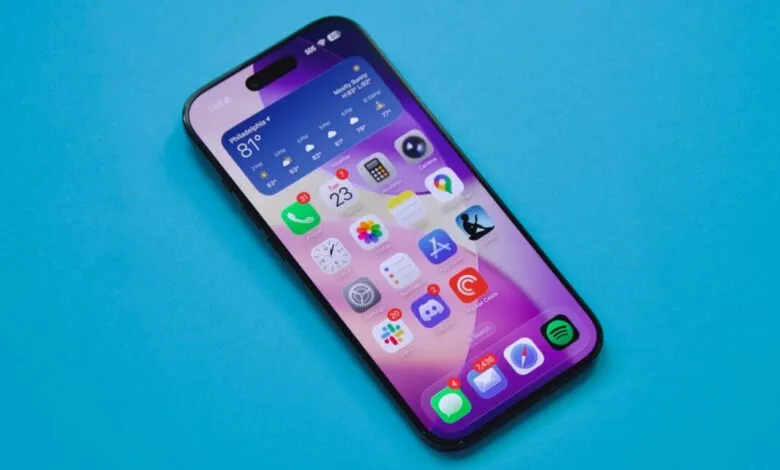 iPhone displaying weather, apps, and time on a vibrant blue background.