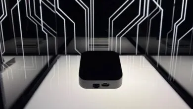 Black rectangular device on display, featuring ports and a minimalist design.