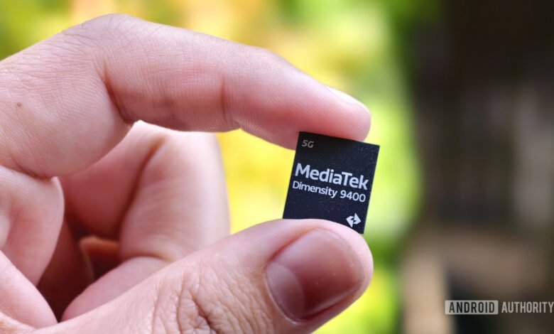 Close-up of a hand holding a small MediaTek Dimensity 9400 5G chip.