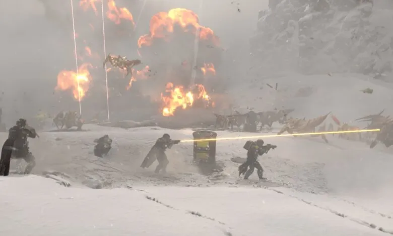 Soldiers in futuristic armor fight alien creatures amidst explosions in a snowy landscape.