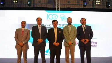 Five men in suits stand on stage at the ICC Technopreneurship Asia 2025 event.