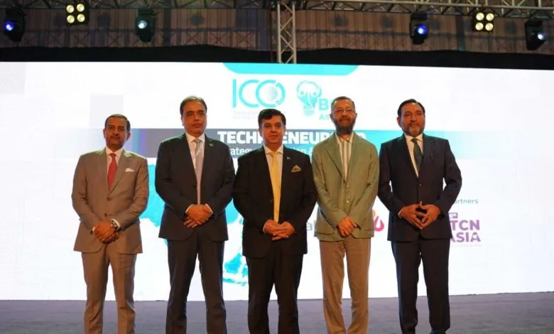 Five men in suits stand on stage at the ICC Technopreneurship Asia 2025 event.