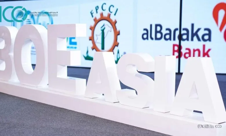Large white letters spelling out BOE ASIA stand on a white platform. Logos of sponsors are visible in the background.