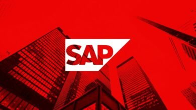 SAP logo superimposed on a red cityscape, symbolizing business and technology.