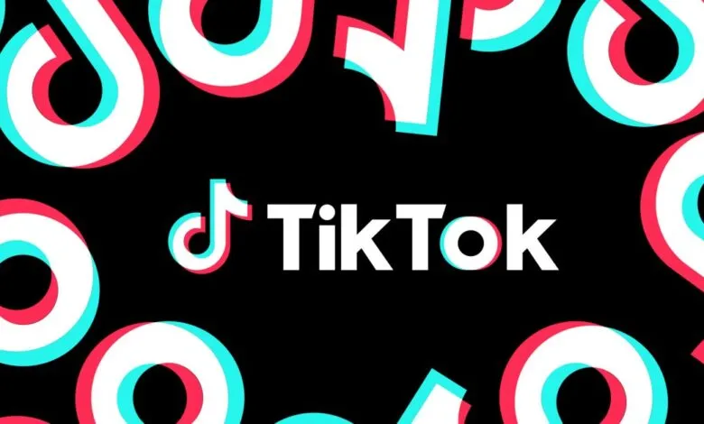 TikTok logo with glitch effect on a black background.