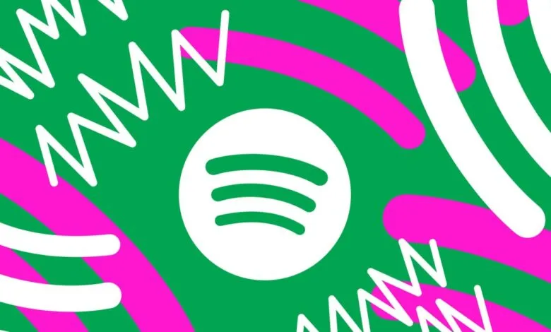 Spotify logo on vibrant green background with pink and white abstract shapes.