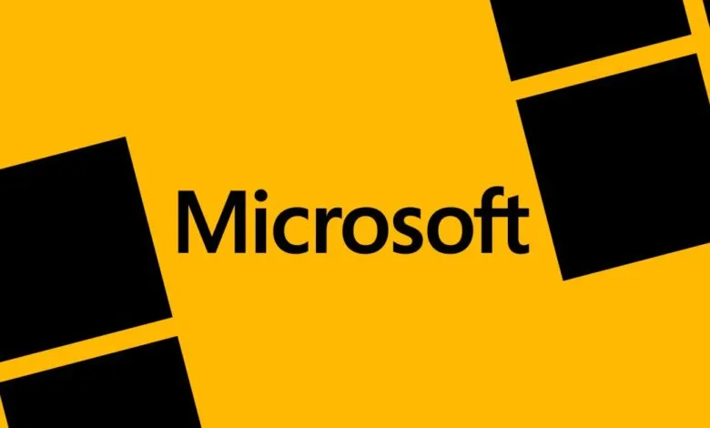 Microsoft logo on a vibrant yellow background with black square design elements.