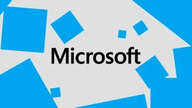 The Microsoft logo in black text on a light gray background with scattered blue squares.