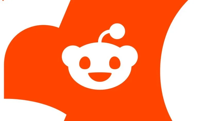 Reddit logo: A friendly white alien face smiles against a vibrant orange background.