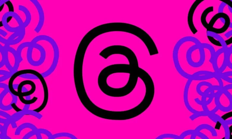 A large black '@' symbol is centered on a vibrant pink background, surrounded by swirling purple and black abstract shapes.