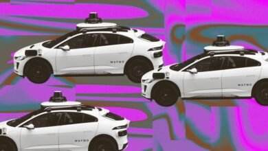 Three white Waymo self-driving cars on a vibrant purple and brown abstract background.