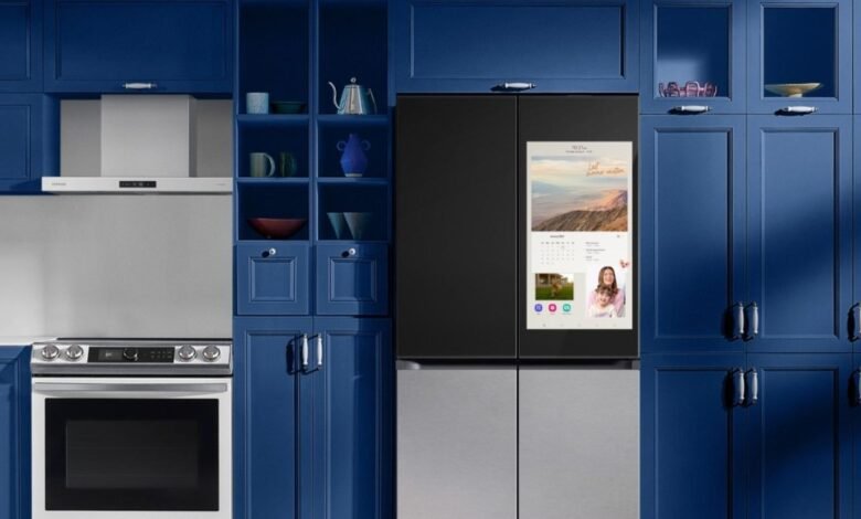Samsung Bespoke Family Hub refrigerator with touchscreen in a navy blue kitchen.