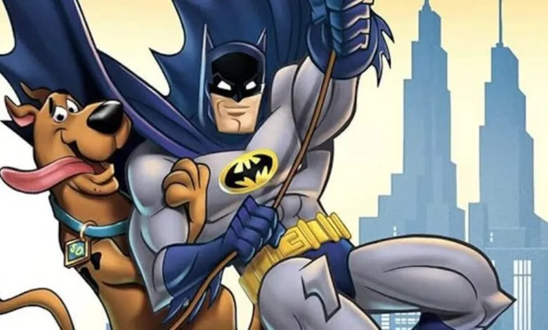 Batman and Scooby-Doo swinging on a rope with a city skyline in the background.