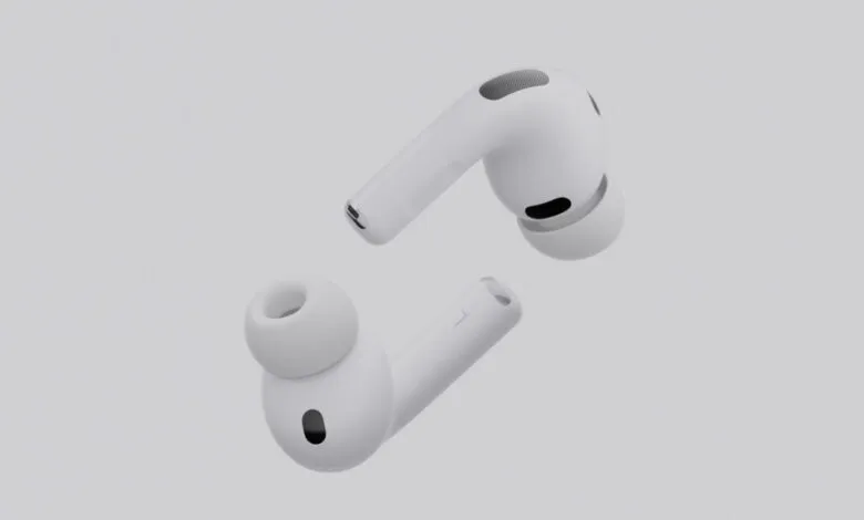 Pair of white Apple AirPods Pro shown from different angles against a light gray background.