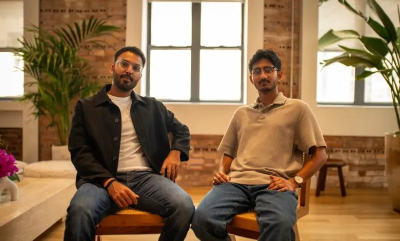 Two men, Shashwat Murarka and Sheel Patel, sit for a portrait in a modern office.