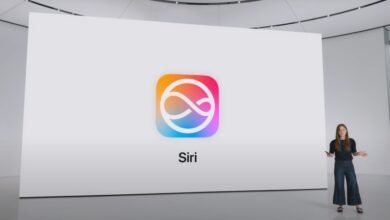 A woman presents the new Siri logo on a large screen at an Apple event.