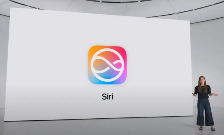 A woman presents the new Siri logo on a large screen at an Apple event.