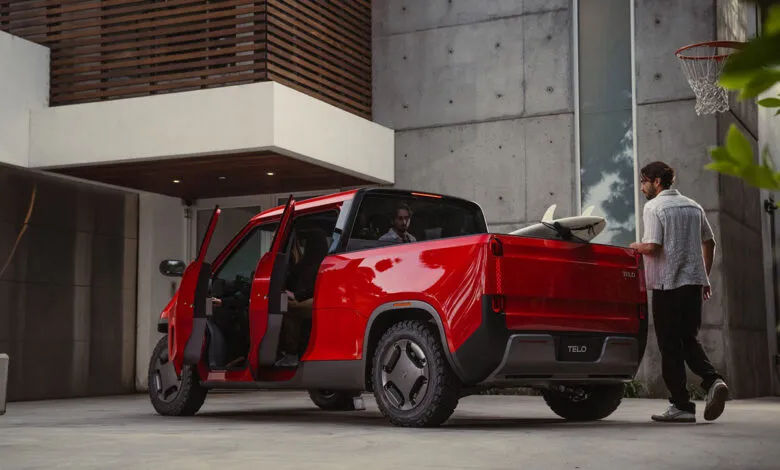 Red TELO all-electric mini truck parked outside a modern home, people loading surfboards.