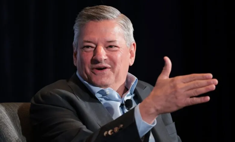 Ted Sarandos, Netflix co-CEO, speaks at an event, gesturing with his hand.