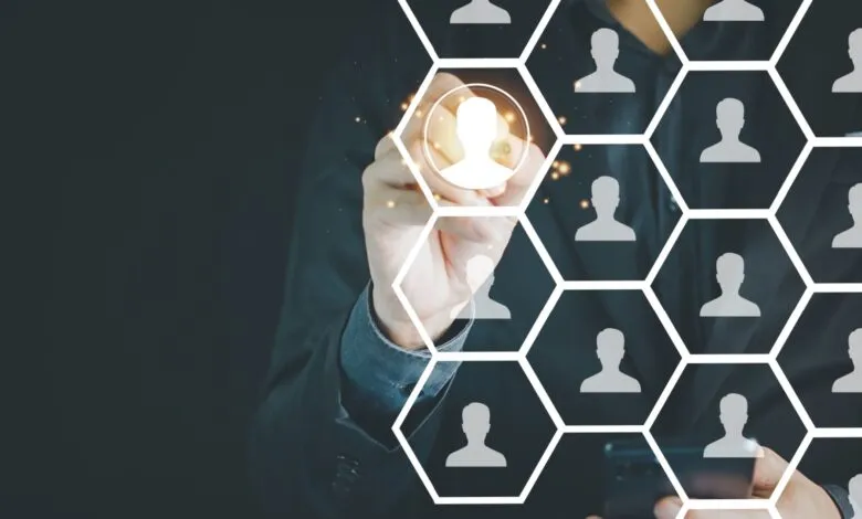 Person selecting a digital profile from a network of users, highlighting AI-driven audience targeting.