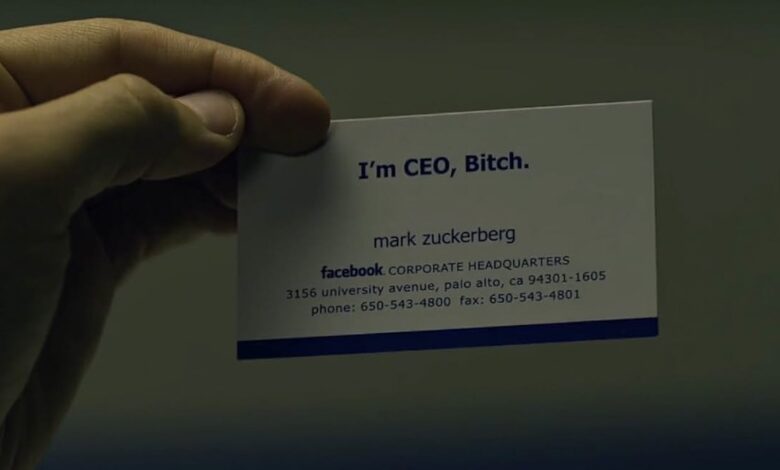 Close-up of a hand holding Mark Zuckerberg's business card, which boldly states, "I'm CEO, Bitch."