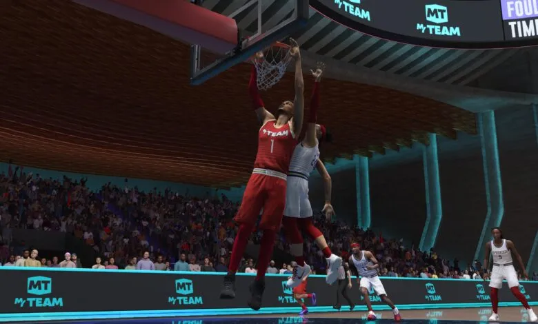 Basketball player dunking in a virtual arena; the player wears a red jersey with 'MyTEAM' logo.