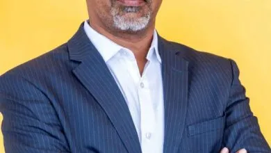 Umasankar Narayanasamy, Vice President at ManageEngine, portrait against yellow background.