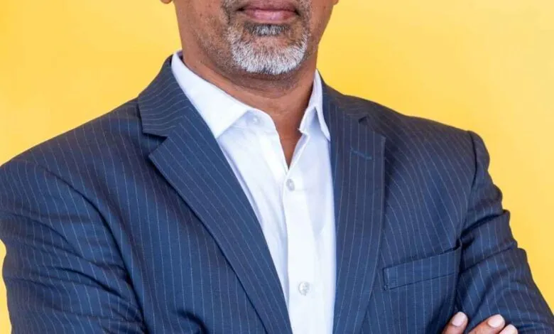 Umasankar Narayanasamy, Vice President at ManageEngine, portrait against yellow background.