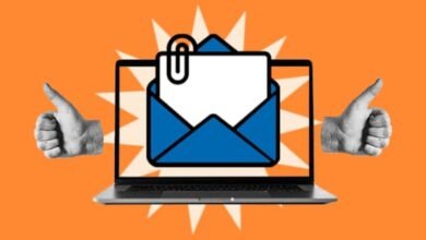 Laptop screen displays an email with a paperclip, two thumbs-up gestures on either side.