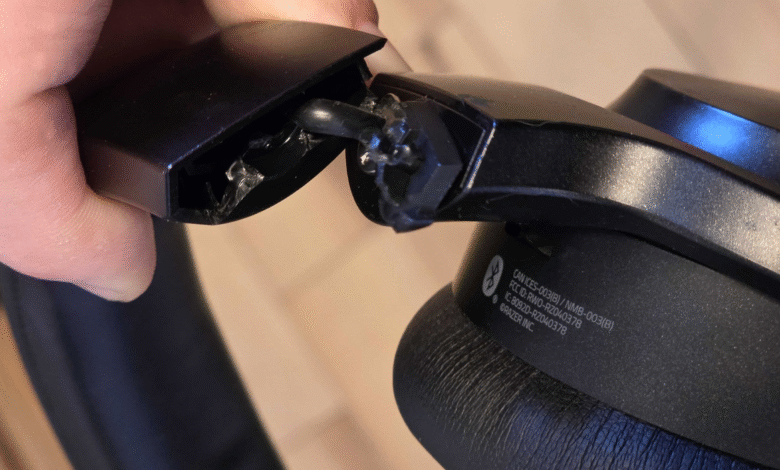 Close-up of broken Razer headphones, showing damaged cable and housing.