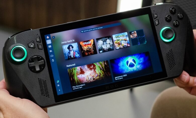 Person holding a black ROG handheld gaming device displaying various game titles and the Xbox logo.