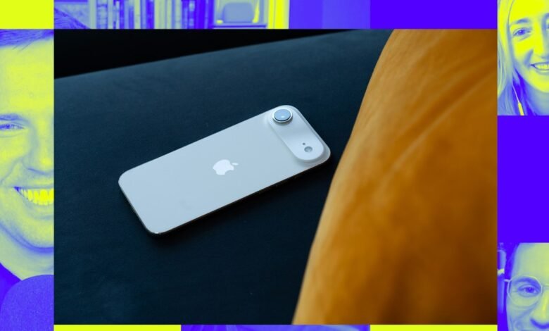 White iPhone 14 resting on a dark surface, surrounded by colorful portraits of podcast hosts.