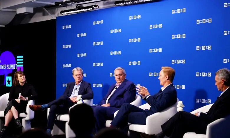 Panel discussion at the WIRED AI Power Summit. Five individuals sit on stage, engaged in conversation.