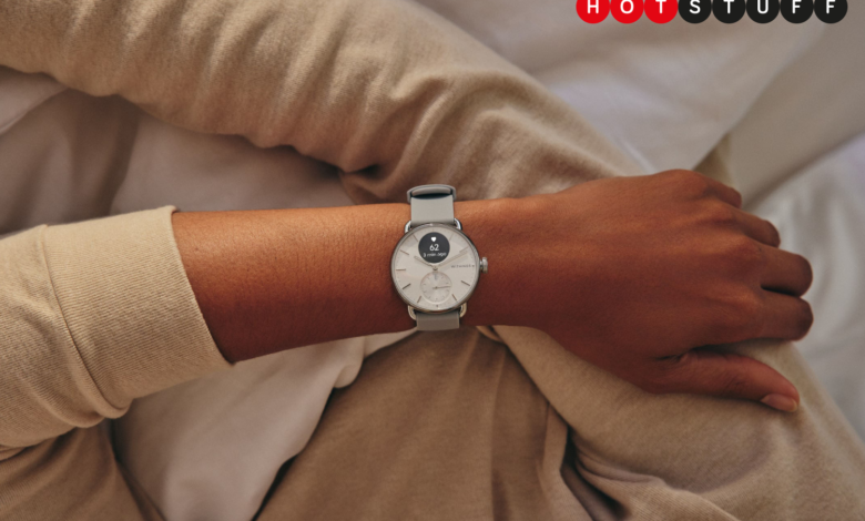 Person wearing a silver Withings ScanWatch 2 smartwatch with a light grey band.
