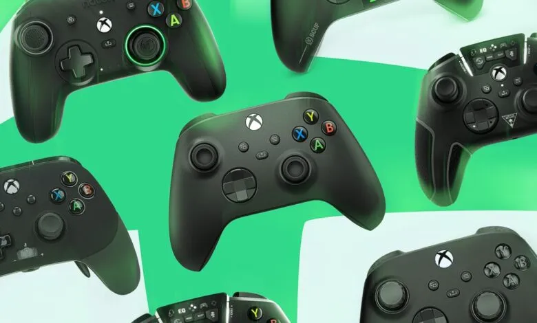 Assortment of black Xbox controllers against a green background. Various designs and brands are shown.