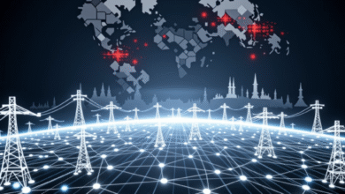 Global power grid with illuminated lines connecting transmission towers and a stylized world map.
