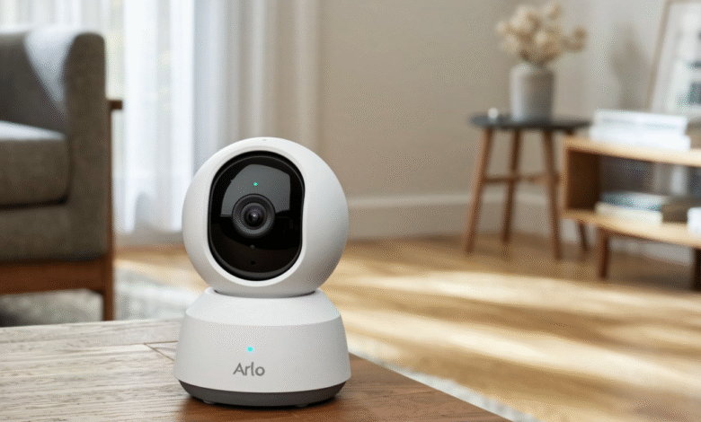 Arlo smart home security camera on a wooden table