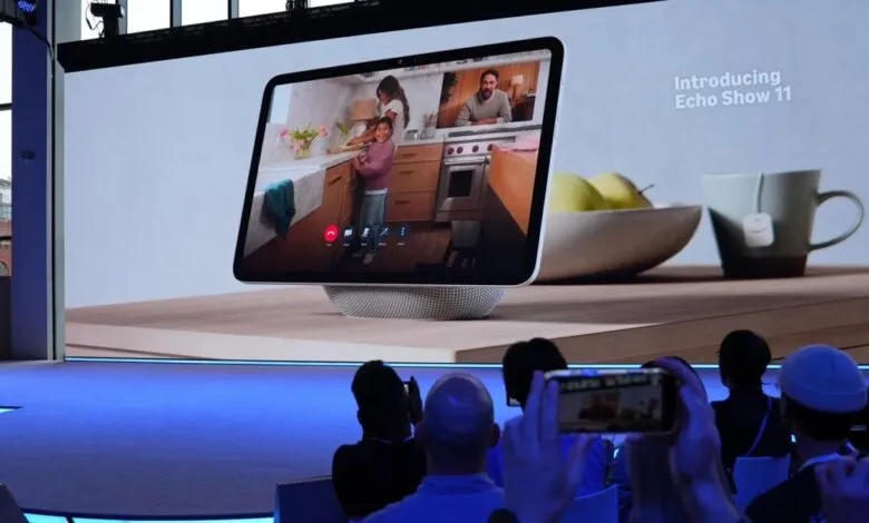 Amazon Echo Show 11 displayed on a large screen during a presentation.