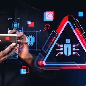 Person using tablet with cybersecurity warning; red and blue triangle with bug symbol.