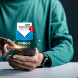 Person receives email warning on smartphone.