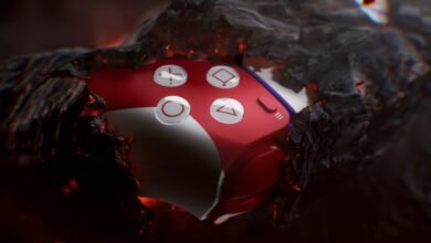 Close-up of a red and white game controller emerging from dark, fiery debris.