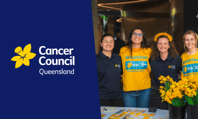 Cancer Council Queensland volunteers smiling at a Daffodil Day event.
