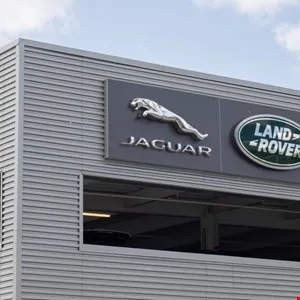 Jaguar and Land Rover logo on a building exterior.