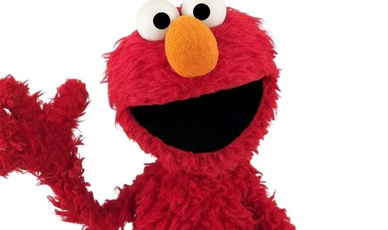 Elmo, the beloved red Sesame Street Muppet, waves cheerfully against a white background.