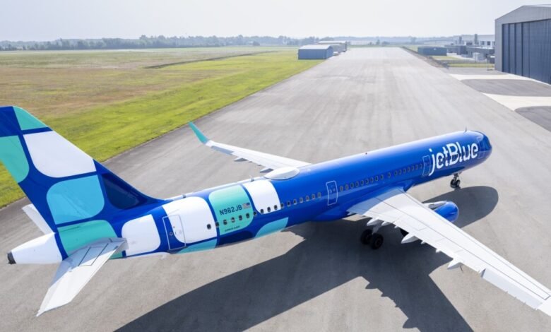 JetBlue Airbus A321neo airplane on tarmac, blue and teal livery.