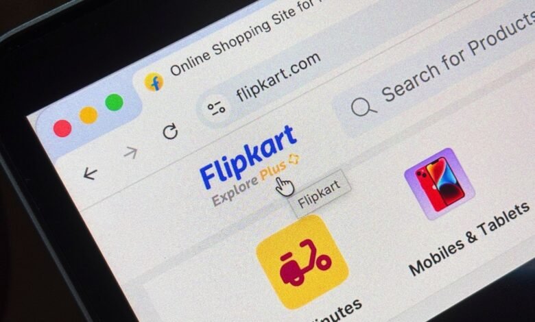 Close-up of a computer screen showing the Flipkart website with a cursor hovering over the 'Flipkart' button.